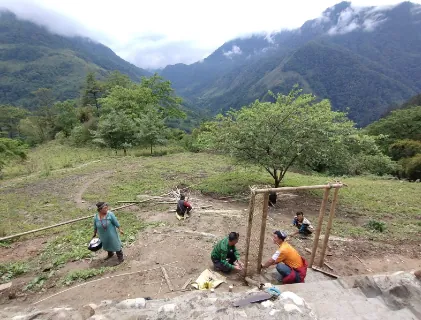 Villagers making a traditional gateway for the new building